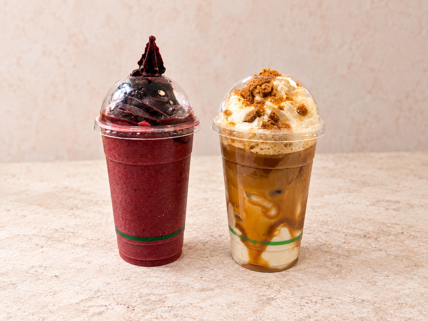 Two specialty drinks with berry and caramel flavours